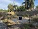 Landscaped backyard with seating and stone features, ideal for outdoor gatherings and relaxation at 11376 119Th Ter, Largo, FL 33778