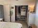Bright, organized closet with shelving and hanging space in bedroom featuring a white dresser and neutral decor at 11376 119Th Ter, Largo, FL 33778