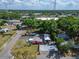 Aerial view of a commercial property with a mobile home and ample parking, showing the surrounding neighborhood at 126 Ridgewood Ave, Brandon, FL 33510