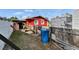 The backyard of the building has fencing, and miscellaneous items scattered around the yard at 126 Ridgewood Ave, Brandon, FL 33510