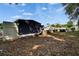 Spacious backyard with mature trees, offering a private and serene outdoor area at 126 Ridgewood Ave, Brandon, FL 33510
