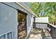 Inviting balcony with wood flooring and a relaxing bench seating area at 126 Ridgewood Ave, Brandon, FL 33510