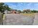 Charming red commercial building with ample parking on a sunny day at 126 Ridgewood Ave, Brandon, FL 33510