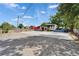 A large parking area provides convenient access to the front of the commercial building at 126 Ridgewood Ave, Brandon, FL 33510