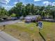 Exterior view shows building, grassy yard and ample parking at 126 Ridgewood Ave, Brandon, FL 33510