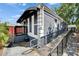 View of home featuring a ramp, railing, and a dark awning at 126 Ridgewood Ave, Brandon, FL 33510