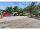 A street view captures the building and its parking space, with green trees in the background at 126 Ridgewood Ave, Brandon, FL 33510