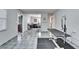Grooming room with tiled floors, grooming table and dog kennels in the background at 126 Ridgewood Ave, Brandon, FL 33510