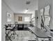 Bright grooming room featuring tiled floors, dog kennels, and grooming table at 126 Ridgewood Ave, Brandon, FL 33510