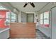 An interior view showcases a reception area featuring a wooden counter, tile flooring, and ceiling fan at 126 Ridgewood Ave, Brandon, FL 33510