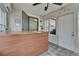 A reception desk with a wooden countertop and tile flooring faces a doorway to the next room at 126 Ridgewood Ave, Brandon, FL 33510