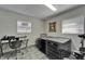 Functional pet area with dog kennels, desk and chair, and windows, creating a comfortable space for furry friends at 126 Ridgewood Ave, Brandon, FL 33510