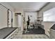 Bright pet grooming room featuring grooming tables, work area, tiled floor, and a convenient grooming tub at 126 Ridgewood Ave, Brandon, FL 33510