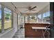 Bright reception area features large windows, tiled flooring, and a ceiling fan at 126 Ridgewood Ave, Brandon, FL 33510