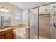 Bright bathroom with a tiled shower and a soaking tub offers a spa-like experience at 12831 White Bluff Rd, Hudson, FL 34669