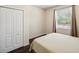 Bright bedroom with a window, a spacious closet, and a comfortable bed at 12831 White Bluff Rd, Hudson, FL 34669