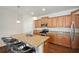 Modern kitchen with granite countertops, stainless steel appliances, and a convenient island with bar seating at 12831 White Bluff Rd, Hudson, FL 34669