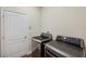 Modern laundry room features stainless steel washer and dryer, and a convenient door at 12831 White Bluff Rd, Hudson, FL 34669