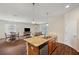 Inviting open-concept space showcases a modern kitchen, dining area, and cozy living room, perfect for Gathering gatherings at 12831 White Bluff Rd, Hudson, FL 34669
