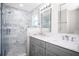 Modern bathroom featuring a glass shower and double sink vanity at 13613 Laraway Dr, Riverview, FL 33579