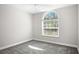 Bedroom with gray walls, plush carpet, a ceiling fan, and a large window at 13613 Laraway Dr, Riverview, FL 33579