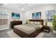 Comfortable bedroom with neutral decor, ceiling fan and large window at 13613 Laraway Dr, Riverview, FL 33579
