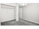 Bedroom with plush carpet, a closet and a chandelier at 13613 Laraway Dr, Riverview, FL 33579
