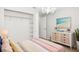 Bedroom with bed, nightstand, dresser, and walk in closet at 13613 Laraway Dr, Riverview, FL 33579