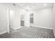 Spacious carpeted bedroom with vaulted ceiling and en-suite bathroom at 13613 Laraway Dr, Riverview, FL 33579