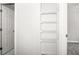 Walk-in closet with metal racks and door at 13613 Laraway Dr, Riverview, FL 33579