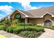 Community center showcases well-maintained landscaping, a brick walkway, and a welcoming entrance for residents at 13613 Laraway Dr, Riverview, FL 33579