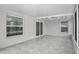 Enclosed lanai showcasing tile floors, ceiling fan, and plentiful windows creating a relaxing and bright space at 13613 Laraway Dr, Riverview, FL 33579