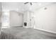 Spacious living room with a fireplace, ceiling fan and neutral carpet at 13613 Laraway Dr, Riverview, FL 33579