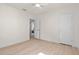 Light and bright bedroom with neutral walls and fan at 1443 Paloma Ln, Dunedin, FL 34698