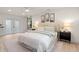This light-filled bedroom features an ensuite bathroom and plenty of natural light at 1443 Paloma Ln, Dunedin, FL 34698