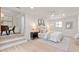 This bedroom features an ensuite bathroom, a ceiling fan and lots of natural light at 1443 Paloma Ln, Dunedin, FL 34698