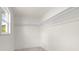 Spacious walk-in closet offers ample storage space and is brightly lit at 1443 Paloma Ln, Dunedin, FL 34698