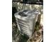 Well-maintained air conditioning unit installed next to home, surrounded by greenery at 1503 12Th Se Ct # 1503, Largo, FL 33771
