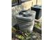 Two air conditioning units are positioned outside the house, surrounded by green foliage at 1503 12Th Se Ct # 1503, Largo, FL 33771