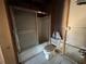Partially renovated bathroom features an installed bath tub with sliding doors at 1503 12Th Se Ct # 1503, Largo, FL 33771