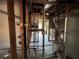 This renovated bathroom reveals electrical and plumbing work with a view into the kitchen at 1503 12Th Se Ct # 1503, Largo, FL 33771