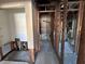 A renovated bathroom shows a bare wall structure, open bathroom, and doorway at 1503 12Th Se Ct # 1503, Largo, FL 33771