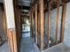 A bathroom in the middle of renovations reveals a bare wall structure and pipes at 1503 12Th Se Ct # 1503, Largo, FL 33771