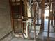 Exposed bathroom area with open framing, ductwork, plumbing and toilet at 1503 12Th Se Ct # 1503, Largo, FL 33771