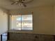 A bedroom's large windows let in light above an exposed wall structure at 1503 12Th Se Ct # 1503, Largo, FL 33771