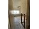 A bedroom view through the doorway with exposed block and a large window at 1503 12Th Se Ct # 1503, Largo, FL 33771