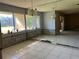 Empty dining room area with tile flooring, large window, and mirror at 1503 12Th Se Ct # 1503, Largo, FL 33771
