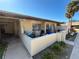 Condo exterior with private front patio area and mature landscaping in an attractive community at 1503 12Th Se Ct # 1503, Largo, FL 33771