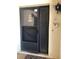 A welcoming front door with secure screen and adjacent textured privacy window at 1503 12Th Se Ct # 1503, Largo, FL 33771