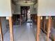 Interior view of a gutted kitchen with tile floors and exposed framing at 1503 12Th Se Ct # 1503, Largo, FL 33771